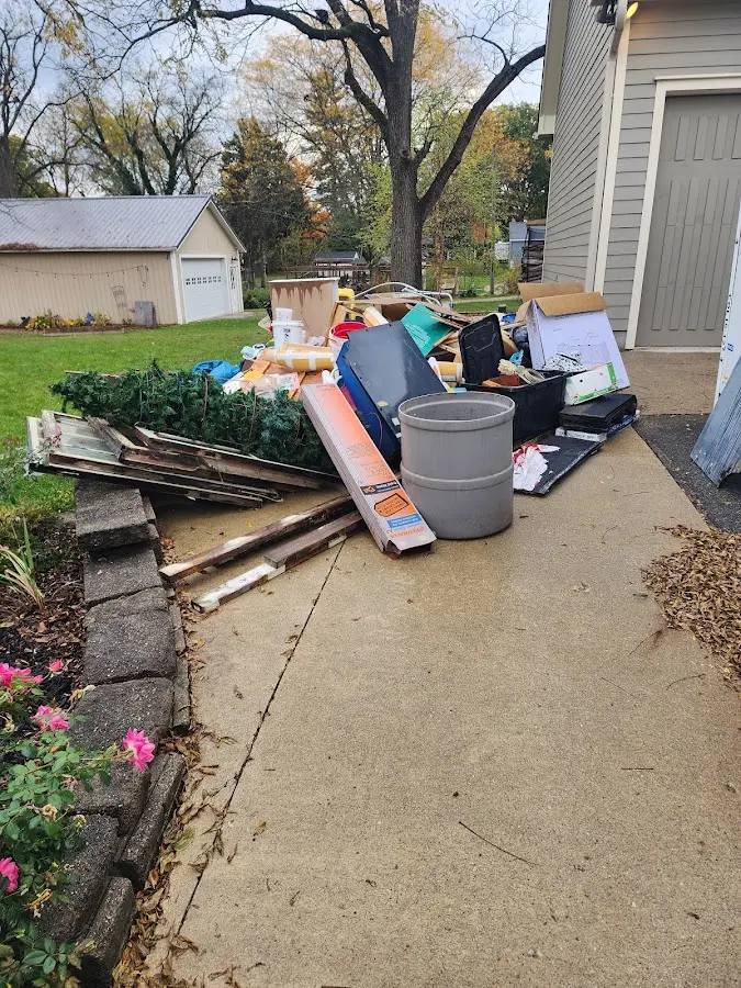 Dumpster being loaded with debris for 30 Yard Dumpster Rental in Eaton Rapids